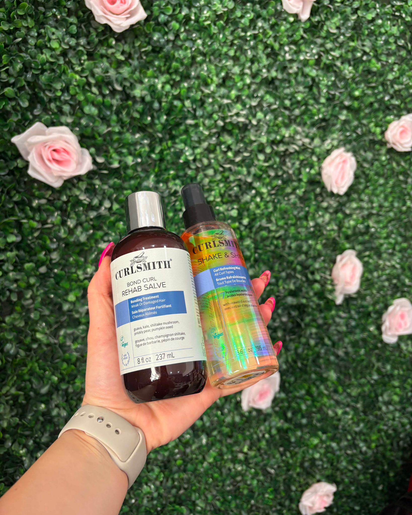 Curlsmith Bond Curl Rehab Salve and Shake & Shine against a flower wall