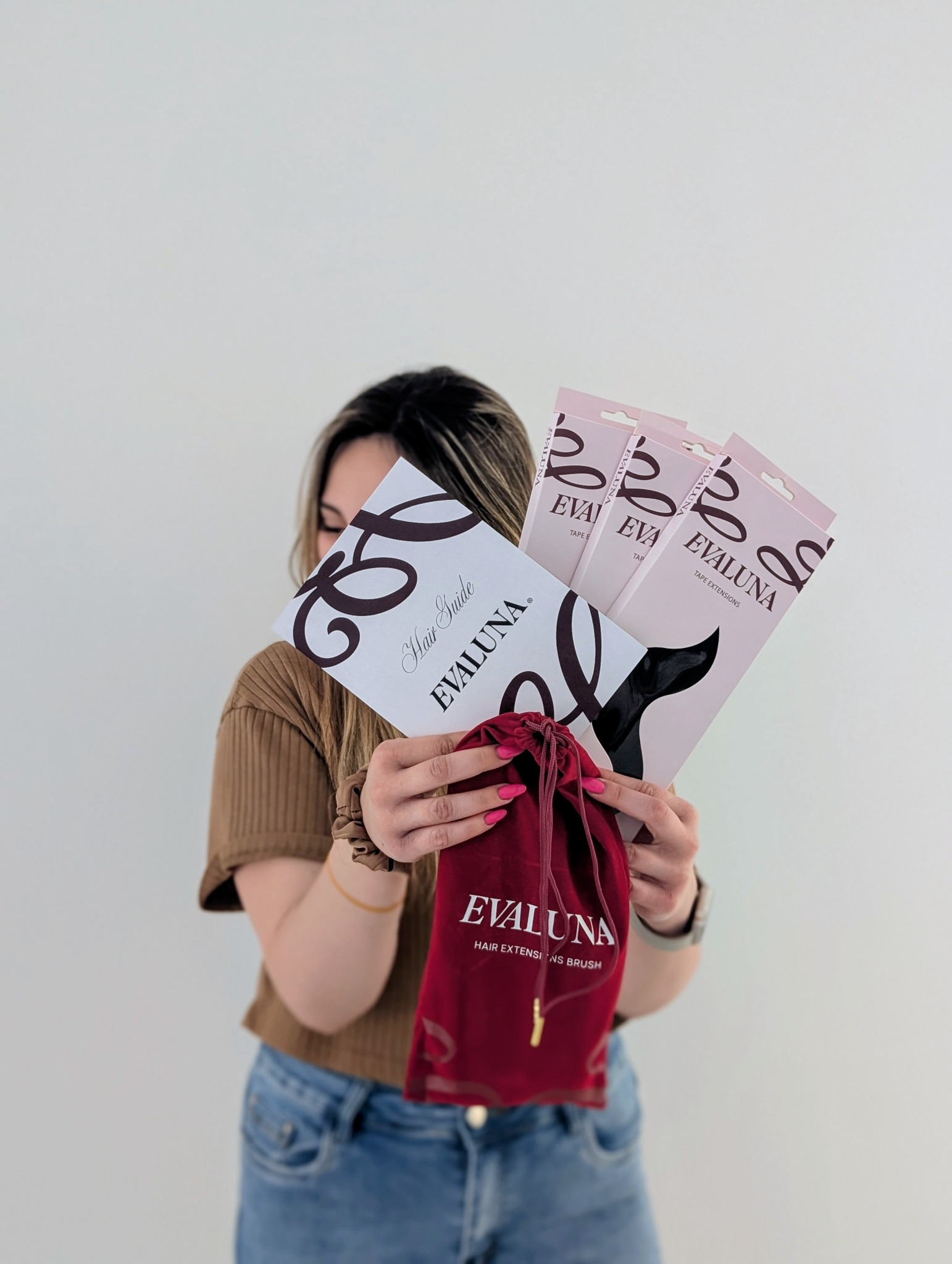 Desailee holding Evaluna extension boxes