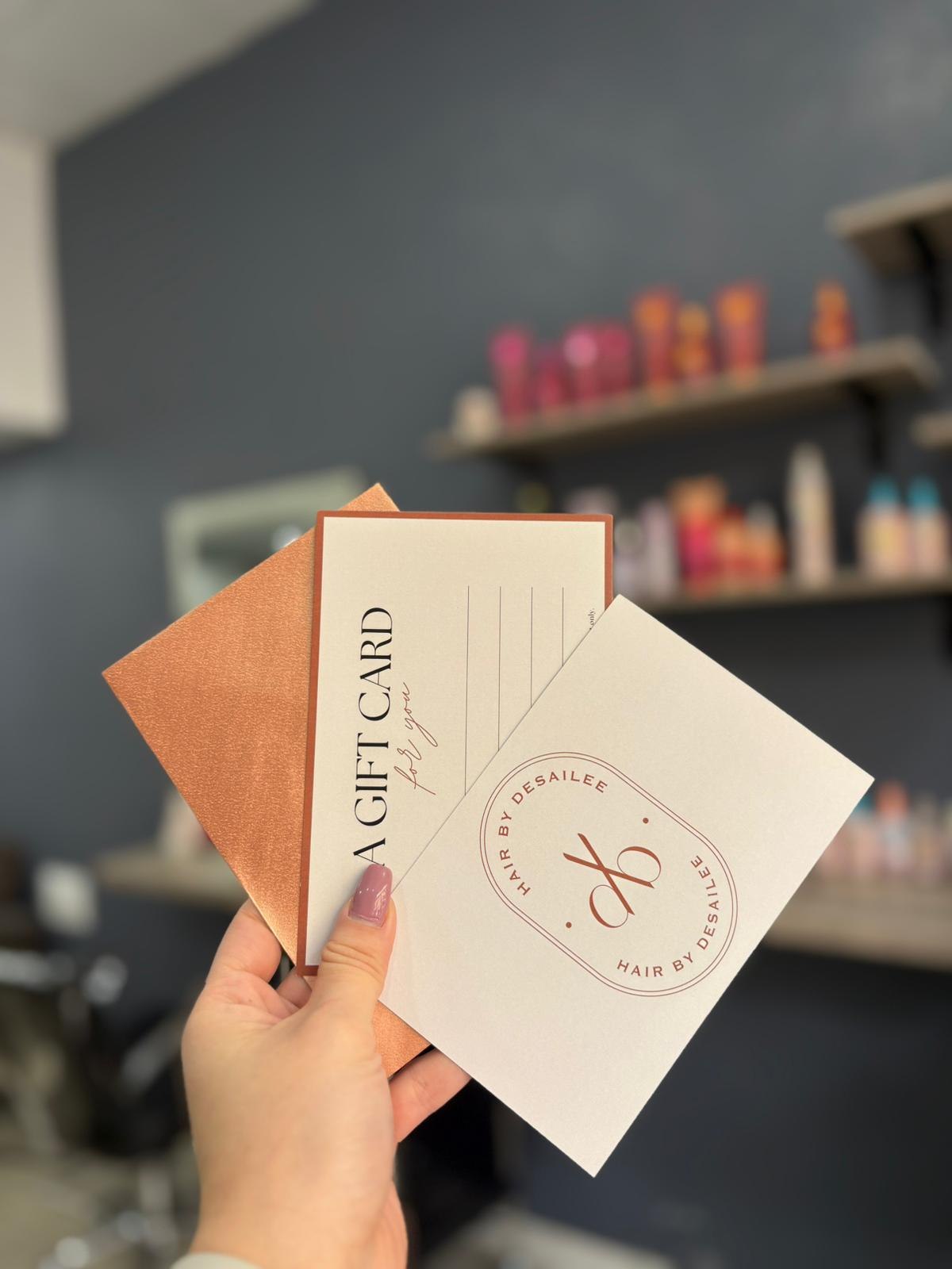 Hair by Desailee gift card presented with a terracotta envelope
