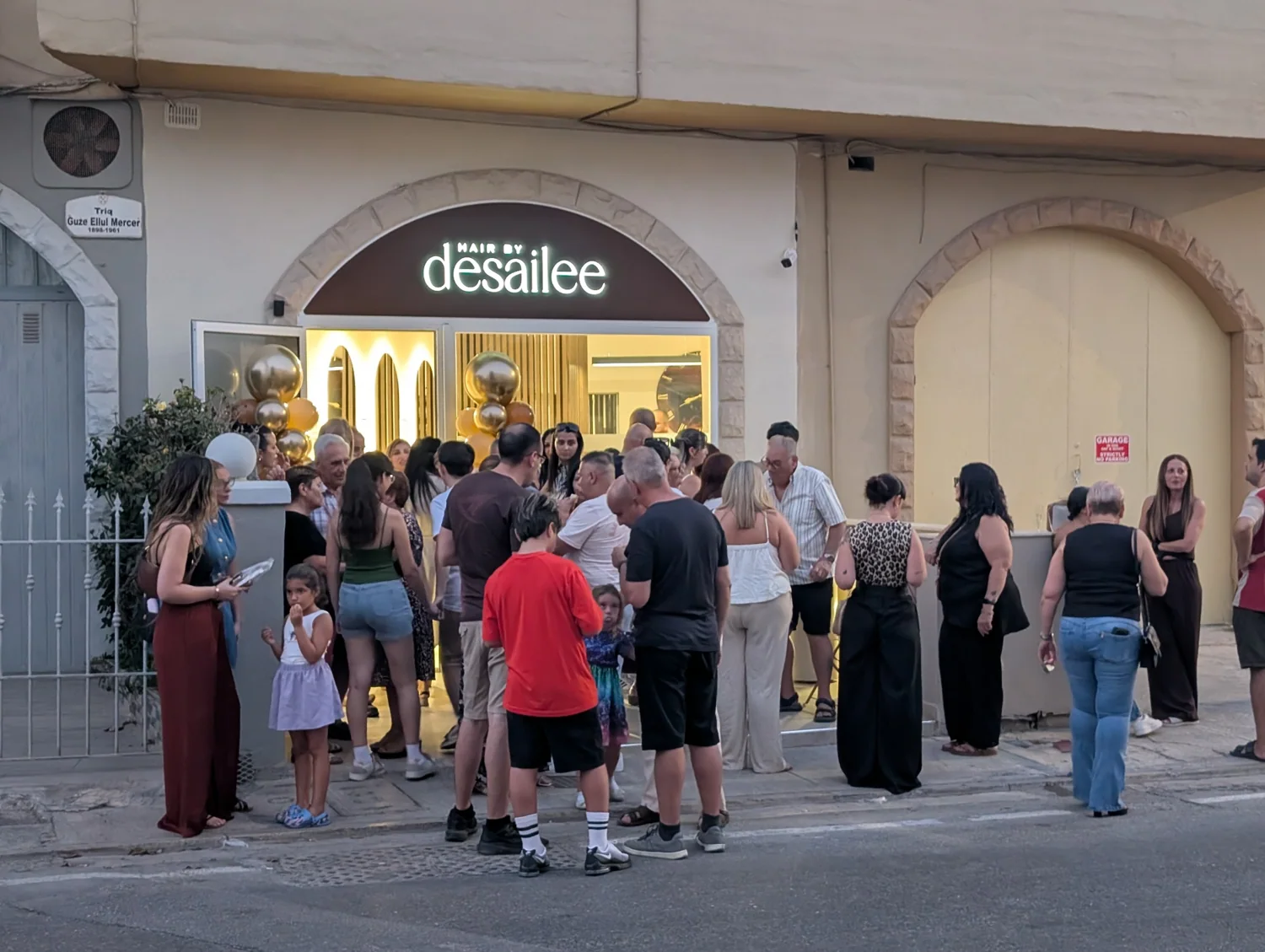 Guests gathered outside Hair by Desailee on opening night