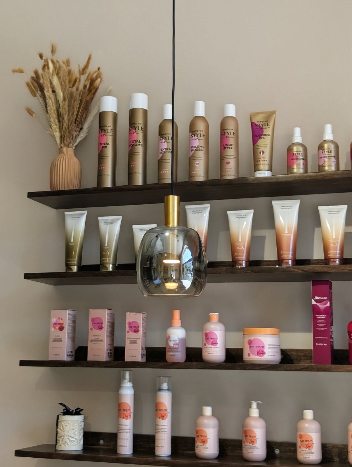 Professional products on the shelves at Hair by Desailee